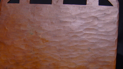 Detail large elongated, "undulating" hammer marks. 